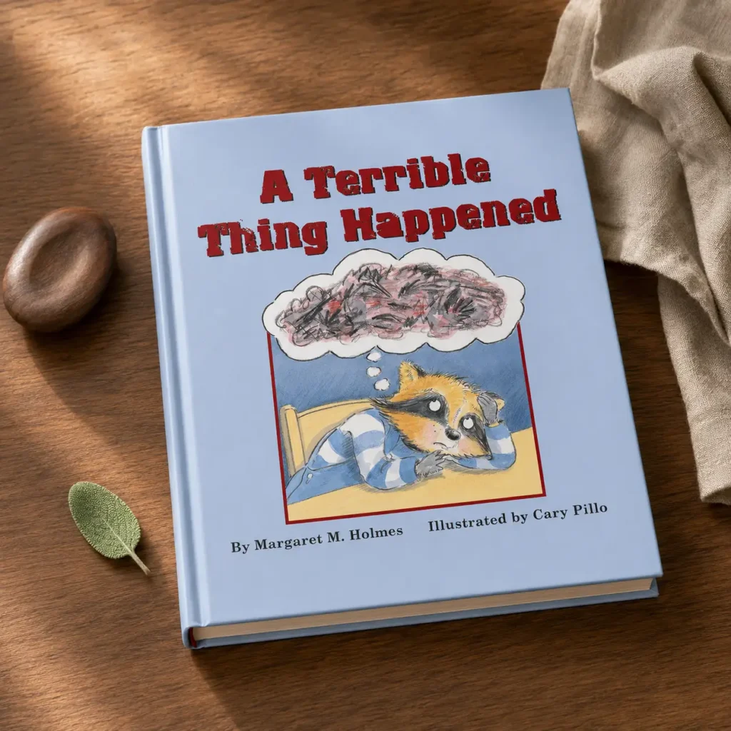 Long Childhood - Children’s book titled “A Terrible Thing Happened” by Margaret M. Holmes, with an illustration of a worried raccoon thinking about a dark cloud, placed on a wooden surface.