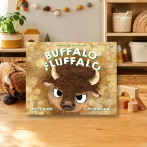 Long Childhood - Children’s book “Buffalo Fluffalo” by Bess Kalb and Erin Kraan displayed on a wooden table, with a plush bison and toys in the background.